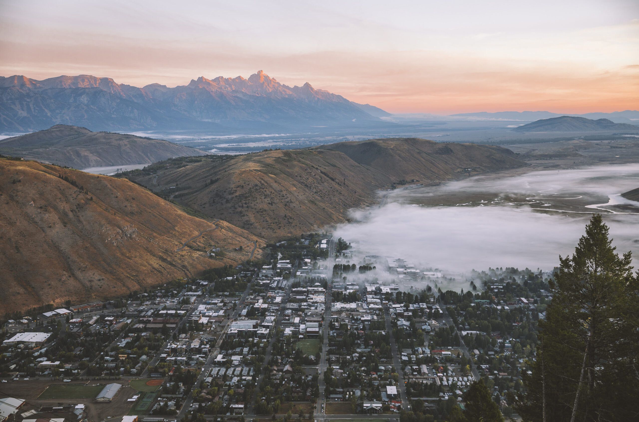 About: Image of the town of Jackson and the Tetons from a birdseye view
